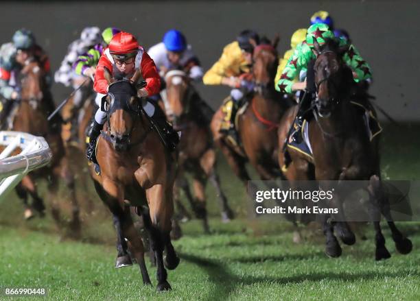 Adam Hyeronimus on Il Mio Destino rounds the home turn on the way to winning race 7 during Canterbury Park Summer Night racing at Canterbury Park...