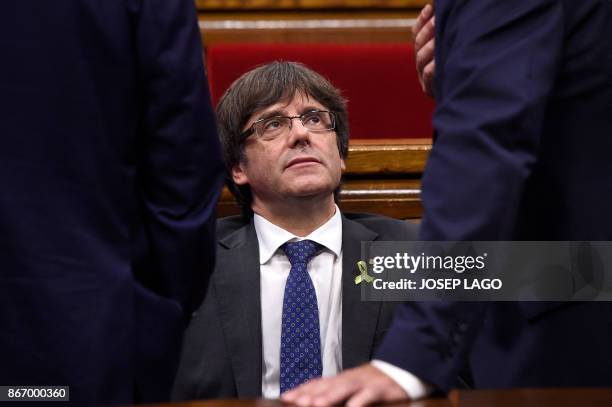 Catalan president Carles Puigdemont attends a session of the Catalan parliament in Barcelona on October 27, 2017. The Catalan parliament will vote on...