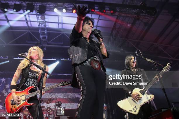 Musicians Nita Strauss, Alice Cooper and Tommy Henriksen perform at The Trusts Arena on October 27, 2017 in Auckland, New Zealand.