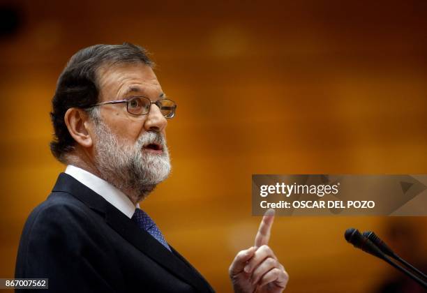 Spain's Prime Minister Mariano Rajoy gives a speech during a session of the Upper House of Parliament in Madrid on October 27, 2017. The central...