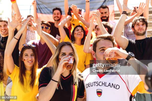 deutschland supporters at stadium during a football league - deutschland fan imagens e fotografias de stock