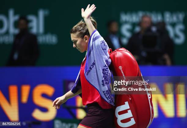 Simona Halep of Romania walks off court after her defeat to Elina Svitolina of Ukraine in their singles match during day 6 of the BNP Paribas WTA...