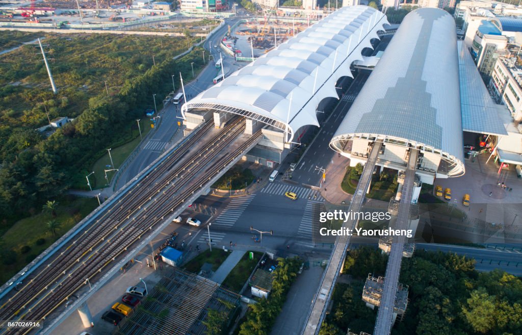 Bird view of Shanghai maglev (right) and metro station (left),taken by drone
