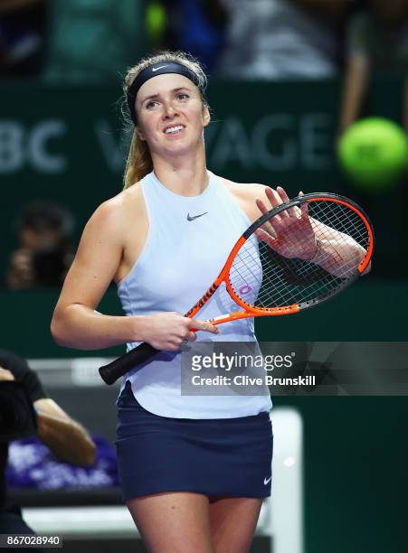 Elina Svitolina of Ukraine celebrates victory in her singles match against Simona Halep of Romania during day 6 of the BNP Paribas WTA Finals...