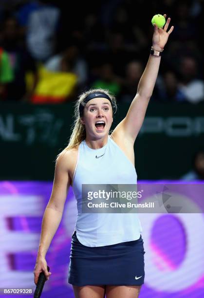 Elina Svitolina of Ukraine celebrates victory in her singles match against Simona Halep of Romania during day 6 of the BNP Paribas WTA Finals...