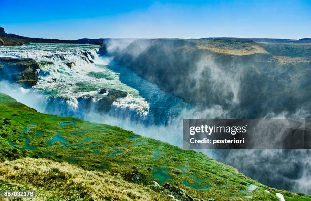 beautiful waterfall in the summer of iceland - posteriori stock pictures, royalty-free photos & images
