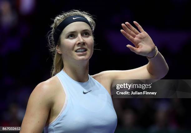 Elina Svitolina of Ukraine celebrates victory in her singles match against Simona Halep of Romania during day 6 of the BNP Paribas WTA Finals...