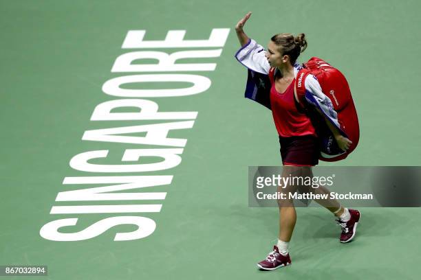 Simona Halep of Romania walks off court after her defeat to Elina Svitolina of Ukraine in their singles match during day 6 of the BNP Paribas WTA...
