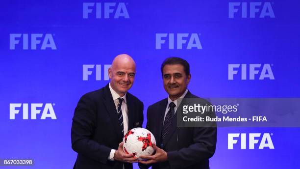 President Gianni Infantino and Praful Patel, President All India Football Federation pose for photographers during a press conference ahead a FIFA...
