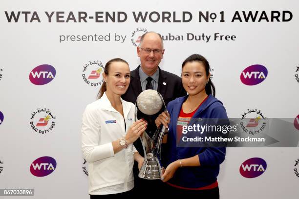 Martina Hingis of Switzerland and Chan Yung-Jan of Chinese Taipei pose with the WTA Year-End World No.1 Award presented by Dubai Duty Free and Steve...