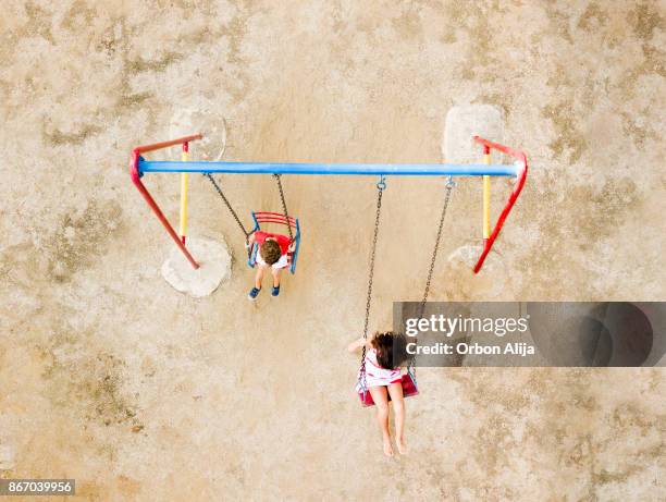 children playing in the park - aerial view of childs playground stock pictures, royalty-free photos & images