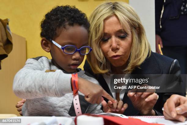 Brigitte Macron, the wife of the French president, visits the "Loisir pluriel" centre for both able-bodied and disabled children in Nantes on October...