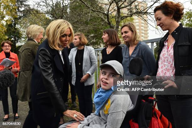 Brigitte Macron, the wife of the French president, arrives to visit the "Loisir pluriel" centre for both able-bodied and disabled children in Nantes...