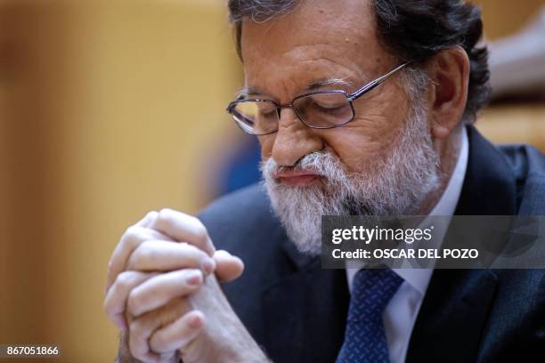 Spain's Prime Minister Mariano Rajoy, gestures as he attends a session of the Upper House of Parliament in Madrid on October 27, 2017. The central...