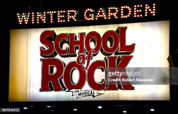 An electrified sign hangs over the entrance of the Winter Garden Theatre in New York City where the musical 'School of Rock' is being staged.