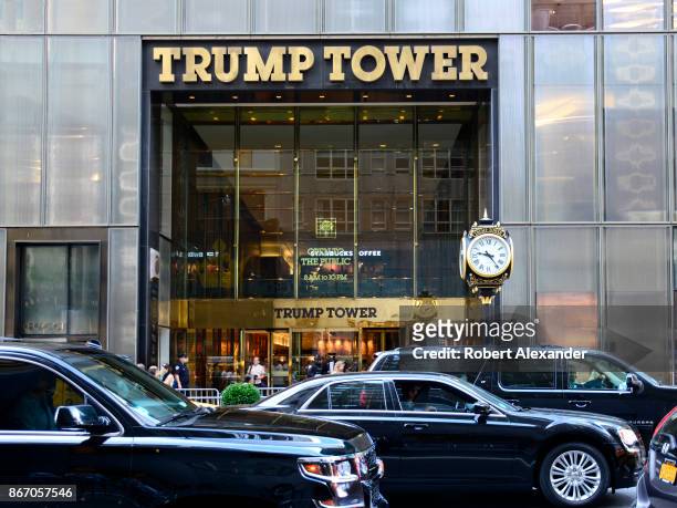 Black limousines pass in front of Trump Tower on Fifth Avenue in New York, New York.
