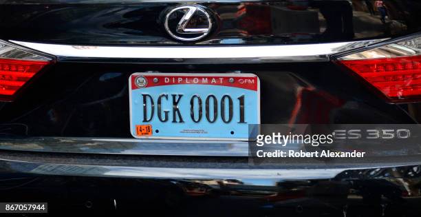 Lexus automobile with a diplomatic license plate is parked along a street in New York, New York. Most countries issue diplomatic license plates to...