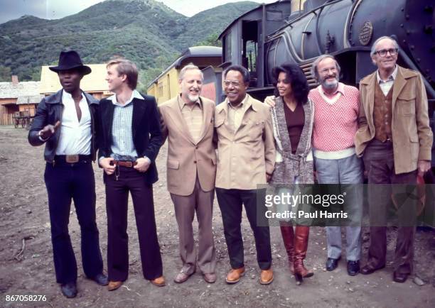 Georg Stanford Brown, Richard Thomas, David L Wolper, Alex Haley, Olivia Cole, Henry Fonda and cast and crew members of Roots attend a photo call in...