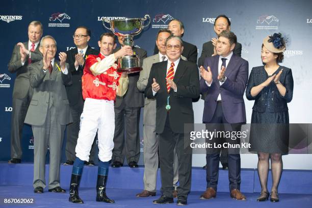 Mr Timothy Fok Tsun Ting, President of the Sports Federation & Olympic Committee of Hong Kong, China, presents the trophy to Hugh Bowman, winner of...