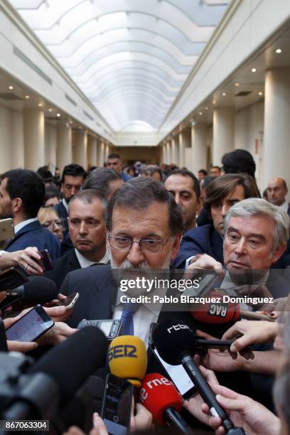 Spain's Prime Minister Mariano Rajoy speaks to the press after a plenary session to approve article 155 of the Spanish Constitution at the Spanish...