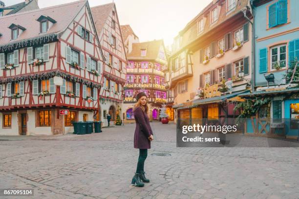 young woman enjoying christmas in colmar, france - strasbourg winter stock pictures, royalty-free photos & images