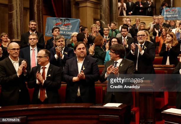 Catalan regional President Carles Puigdemont and deputies of Catalonian Parliament celebrate after Catalonian Parliament declared independence...