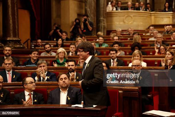 Catalan regional President Carles Puigdemont and deputies of Catalonian Parliament celebrate after Catalonian Parliament declared independence...