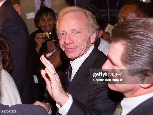 Vice Presidential candidate Joe Lieberman waves to the crowd as he makes a surprise appearance while walking through the floor of the Staples Center...