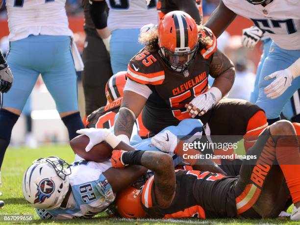 Defensive tackle Danny Shelton of the Cleveland Browns tackles running back DeMarco Murray of the Tennessee Titans in the second quarter of a game on...