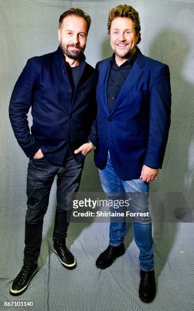 Michael Ball and Alfie Boe pose backstage after signing copies of their new album 'Together Again' at HMV Manchester on October 27, 2017 in...
