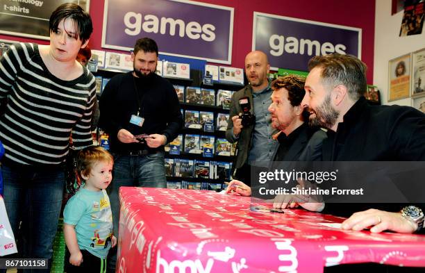 Michael Ball and Alfie Boe sign copies of their new album 'Together Again' at HMV Manchester on October 27, 2017 in Manchester, England.To celebrate...