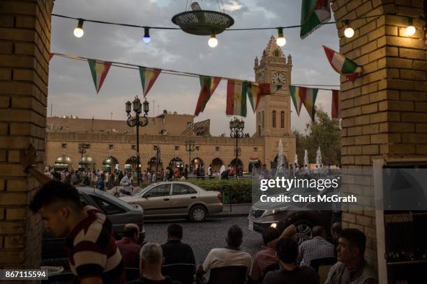 People sit on the street in the old city on October 27, 2017 in Erbil, Iraq. After the Kurdish Regional Government held an independence referendum on...