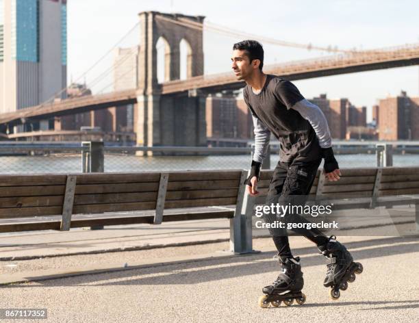 inline skating in new york - inline skating man park stock pictures, royalty-free photos & images