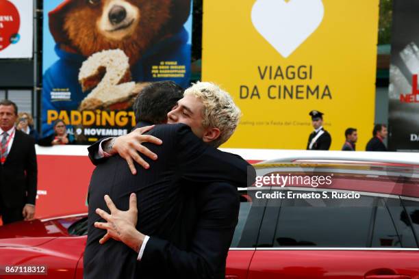 Xavier Dolan and Dierctor of the festival Antonio Monda walk a red carpet during the 12th Rome Film Fest at Auditorium Parco Della Musica on October...