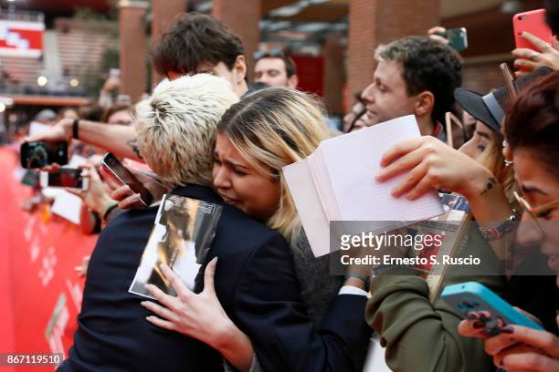 Xavier Dolan greets a fanon the red carpet during the 12th Rome Film Fest at Auditorium Parco Della Musica on October 27, 2017 in Rome, Italy.