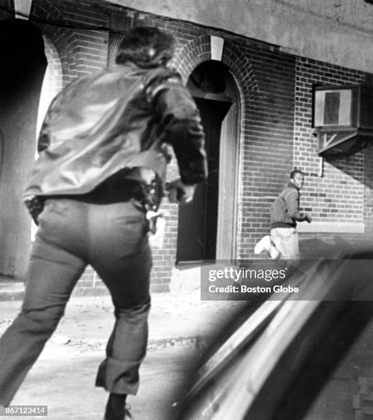 Paramedic Kevin Shea closes in on a youth suspected of grabbing a purse from a teenage girl walking through Dorchester's Edward Everett Square in...