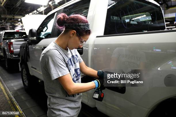 Worker builds a Ford F-250 as it goes through the assembly line at the Ford Kentucky Truck Plant October 27, 2017 in Louisville, Kentucky. Ford...