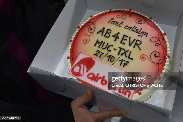 Cake with the logo of German airline Air Berlin, marking the last scheduled flight, is seen at Franz-Josef-Strauss airport in Munich, southern...