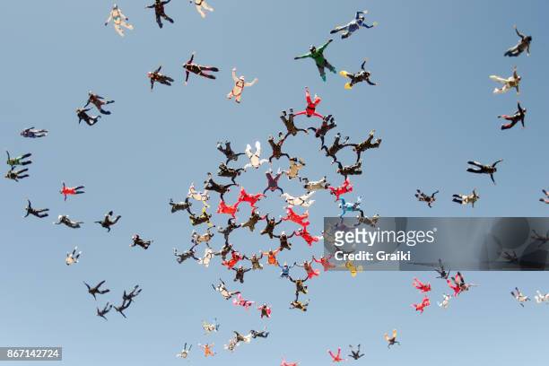 skydiving big group take off - sports team stock pictures, royalty-free photos & images