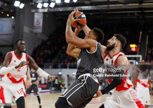 Augustine Rubit, #21 of Brose Bamberg competes with Tornike Shengelia, #23 of Baskonia Vitoria in action during the 2017/2018 Turkish Airlines...
