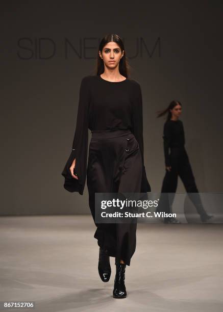 Model walks the runway during the Sid Neigum International show at Fashion Forward October 2017 held at the Dubai Design District on October 27, 2017...