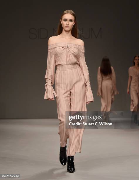 Model walks the runway during the Sid Neigum International show at Fashion Forward October 2017 held at the Dubai Design District on October 27, 2017...