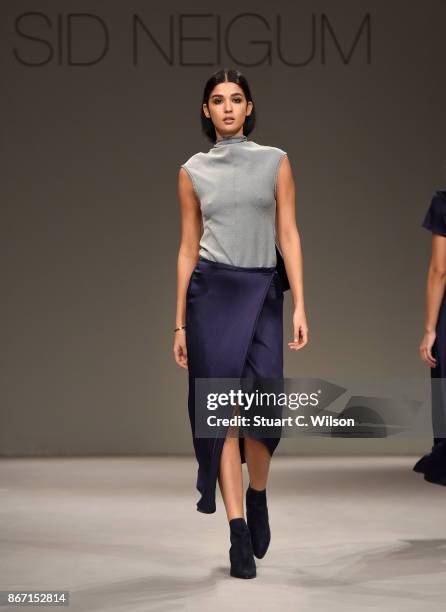 Model walks the runway during the Sid Neigum International show at Fashion Forward October 2017 held at the Dubai Design District on October 27, 2017...