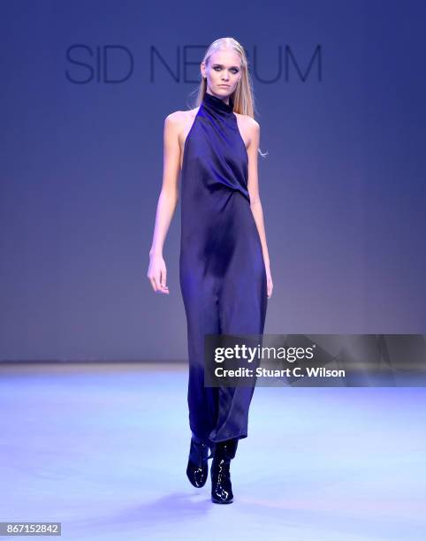 Model walks the runway during the Sid Neigum International show at Fashion Forward October 2017 held at the Dubai Design District on October 27, 2017...