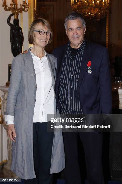 French Ministre of Culture Francoise Nyssen and honorary Israeli Filmmaker Amos Gitai pose at Ministere de la Culture on October 27, 2017 in Paris,...