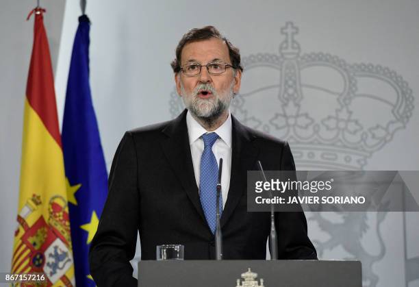 Spanish Prime Minister Mariano Rajoy gives a press conference after a cabinet meeting at La Moncloa Palace in Madrid, on October 27, 2017. Spanish...
