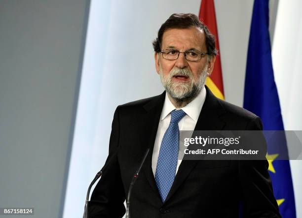 Spanish Prime Minister Mariano Rajoy gives a press conference after a cabinet meeting at La Moncloa Palace in Madrid, on October 27, 2017. Spanish...