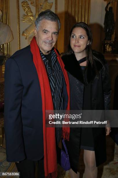 Honorary Israeli Filmmaker Amos Gitai poses with his daughter, Keren Mock at the Ministere de la Culture on October 27, 2017 in Paris, France.