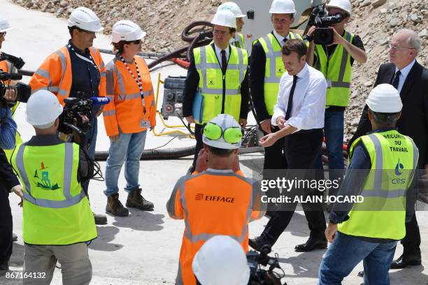 French president Emmanuel Macron arrives to the Ariane 6 building site on October 27, 2017 at the Kourou space center, as part of a three-day visit...