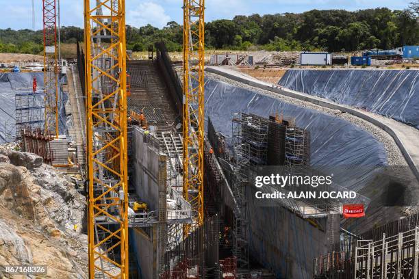 Workers are pictured on the Ariane 6 building site on October 27, 2017 at the Kourou space center in French Guiana. The Ariane 6 is a launch vehicle...